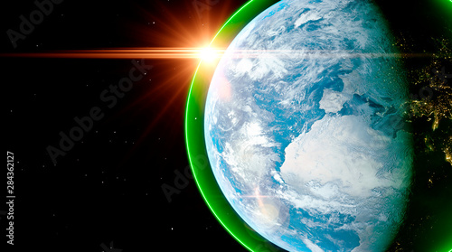 Fototapeta Naklejka Na Ścianę i Meble -  Clean environment planet Earth concept with the planet surrounded by a green haze boundary and sun flare