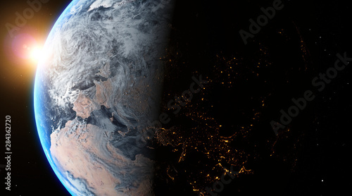 Fototapeta Naklejka Na Ścianę i Meble -  Sunrise over the planet Earth concept with a bright sun and flare and city lights
