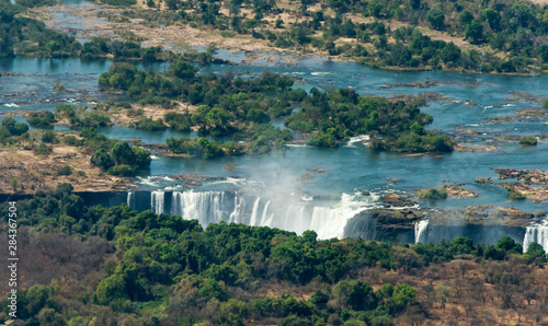 Aerial view of Zambezi river pouring into Victoria Falls, Zimbabwe photo