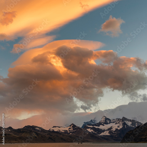 Cumberland East Bay and the mountains of the Allardyce Range. Typical cloudscape of South Georgia. photo