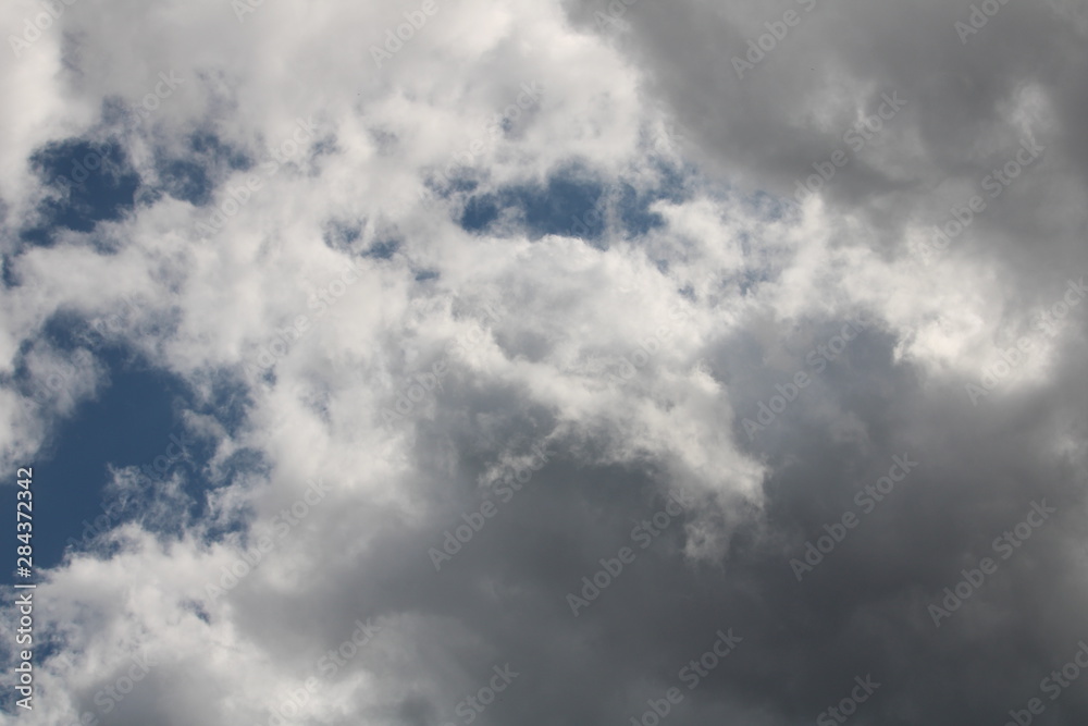 Fototapeta premium white cloud cover with a bit of blue sky