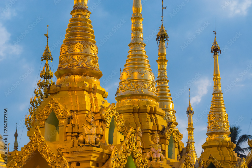 Fototapeta premium Myanmar. Yangon. Shwedagon Pagoda. Golden spires gleam at twilight.