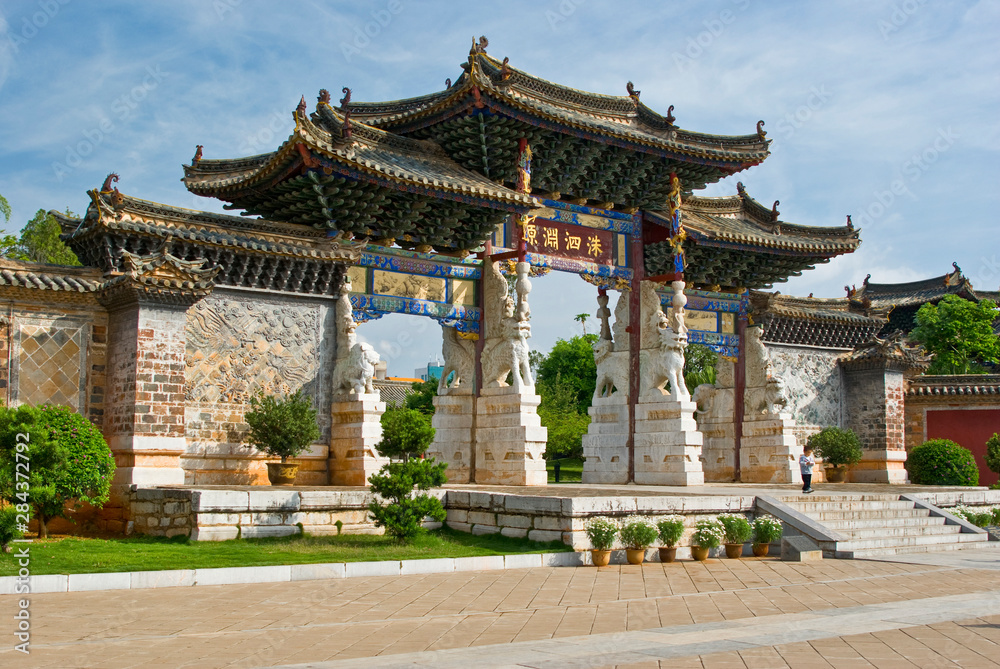 Asia, China, Yunnan Province, Jianshui. Little boy at one of four ornate gates at the Confucious Temple.