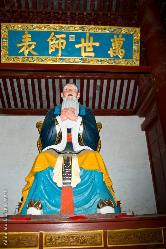Asia, China, Yunnan Province, Mojiang. Painted statue of Confucious at the Confucious temple