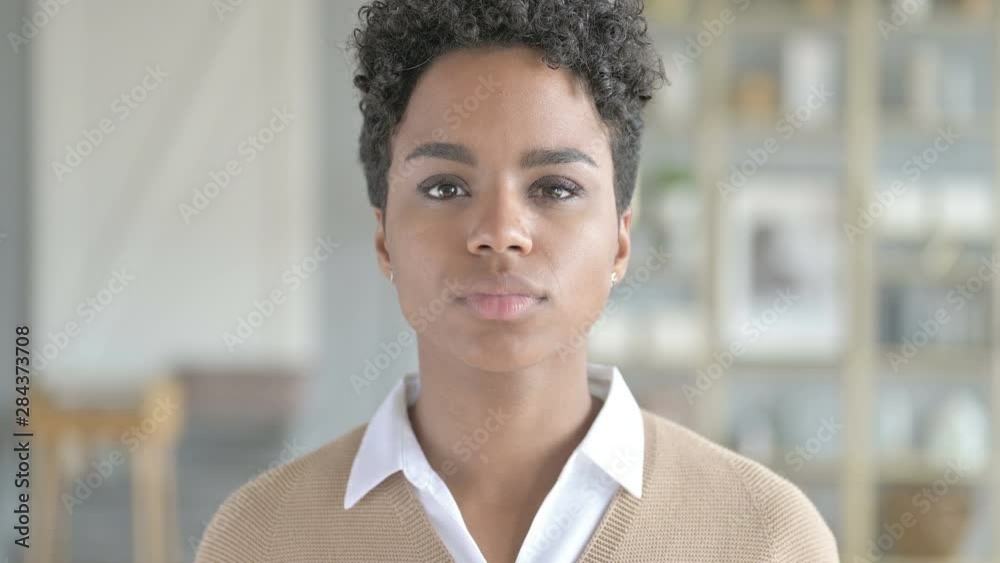 Portrait of pretty African Girl Showing Silence Sign Portrait of pretty African Girl Showing Silence Sign