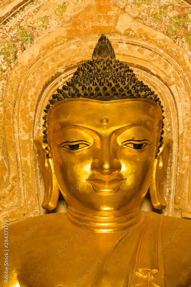 Myanmar. Bagan. Htilominlo Temple. Golden Buddha.