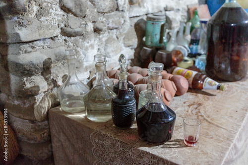 Georgia, Kakheti. Traditionally made wine in glass bottles.