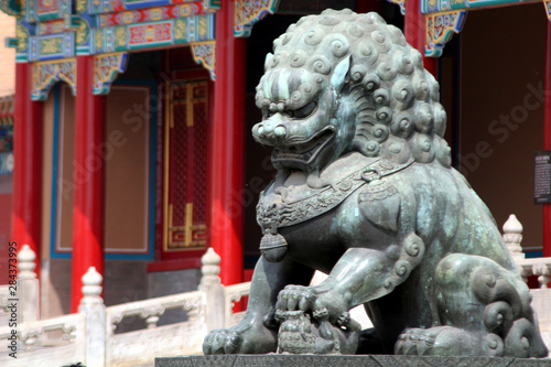 Asia, China, Beijing. Fu Dog statue at Forbidden Palace