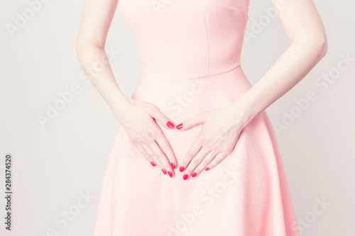 Wallpaper Mural The girl has a stomach ache, the beginning of the menstrual cycle, she touches belly, Torontodigital.ca