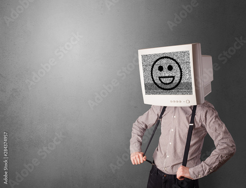 Young person with monitor head, old school smile concept photo