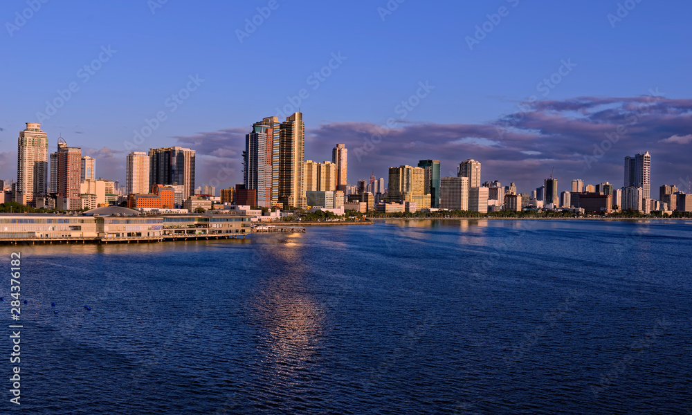 Evening sea departure in a setting sun from Manila, Philippines Evening sea departure in a setting sun from Manila, Philippines