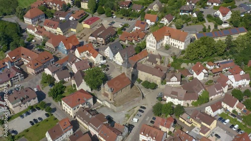 Aerial view of the city Bad Friedrichshall in Germany.  Round pan to the left above the center of the palace and church. photo