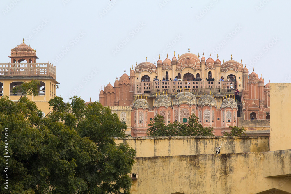 Fototapeta premium India, Rajasthan, Jaipur, Jantar Mantar, open air astronomical observatory. Palace of the Wind, Hawa Mahal, seen from the grounds of the observatory.