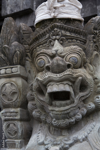 Indonesia, Bali. Temple Statue in a sacred Balinese Hindu site. Balinese Hinduism combines aspects of Animism, Ancestor Worship, Buddhism, and Hinduism.