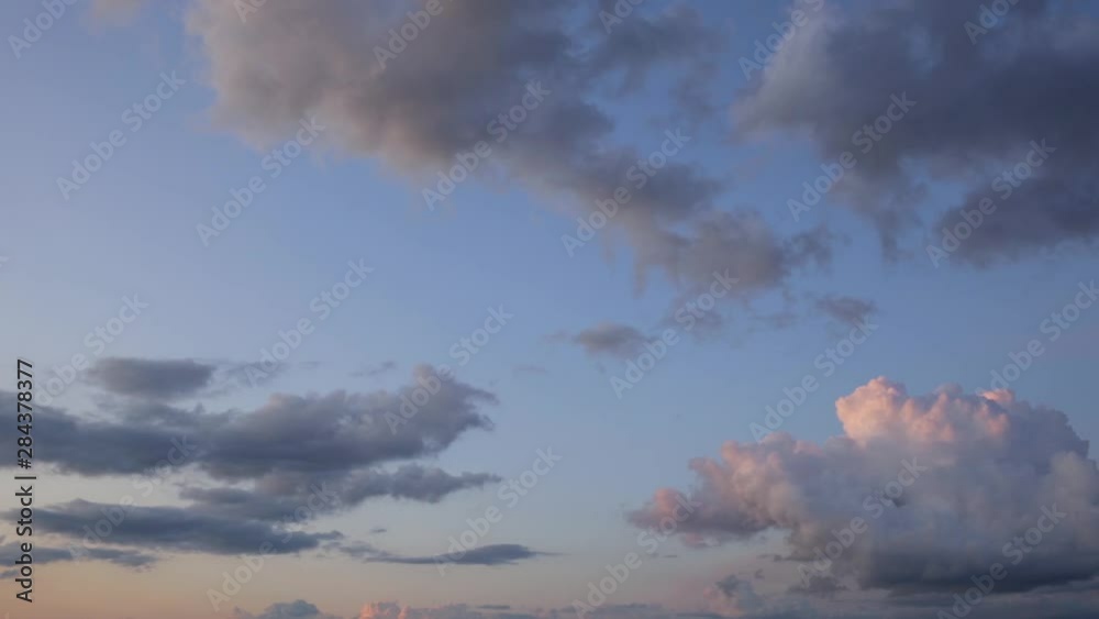 Beautiful sunset clouds flowing in blue sky. Camera moving from left to right. Real time full hd video footage. Beautiful sunset clouds flowing in blue sky. Camera moving from left to right. Real time full hd video footage.