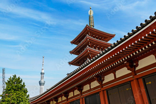 Tokyo, Japan. Five story Asakusa Pagoda and the Tokyo Sky Tree communications tower loom over the Senso-Ji temple complex