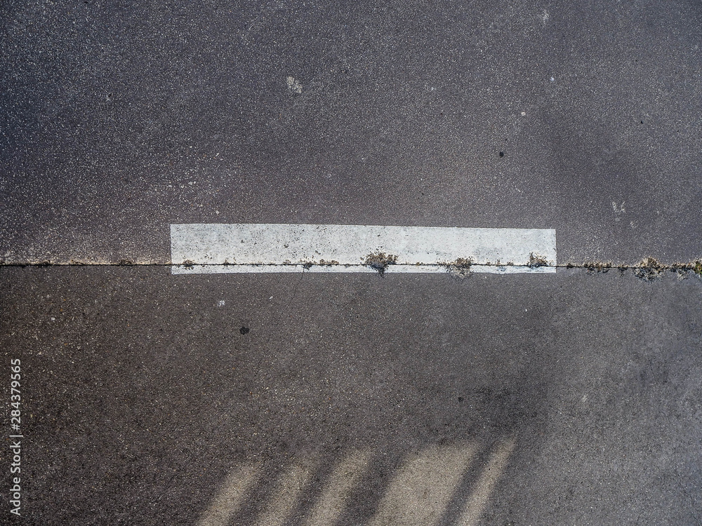 Fototapeta premium Picture from above of an old white line in a break road on the north of Galicia. 