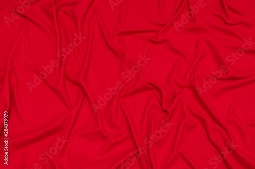Red crumpled blanket, texture, background, top view
