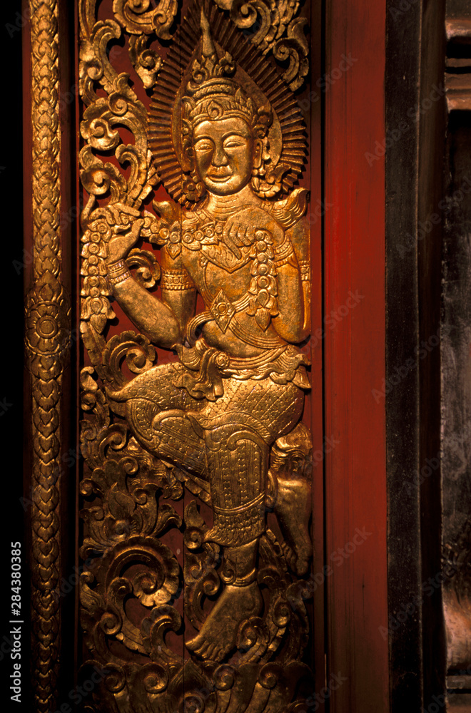 Asia, Laos, Luang Prabang. Wat Xieng Thong, gilt panels from Ramayana.