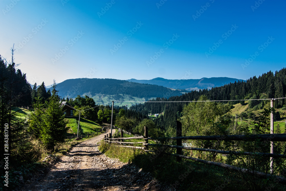 Fence and road at countryside in Carpathian