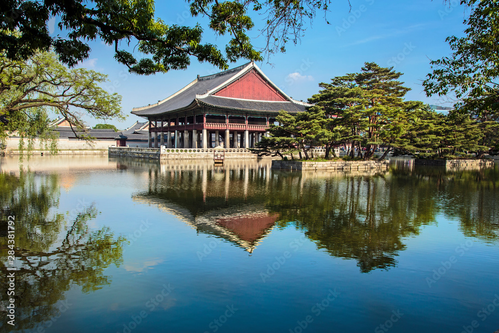 Seoul, South Korea. Geunjeongjeon, Gyeongbokgung Palace, Gyeonghoeru Pavilion and surrounding lake
