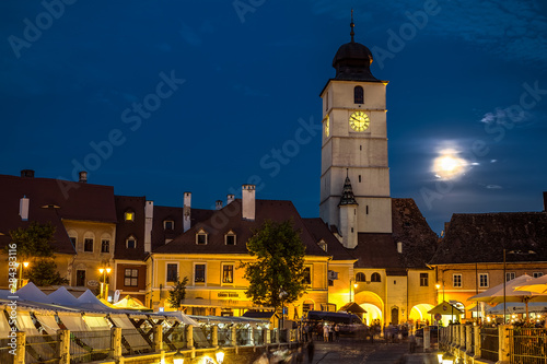 Twilight image of Council Tower with moon photo