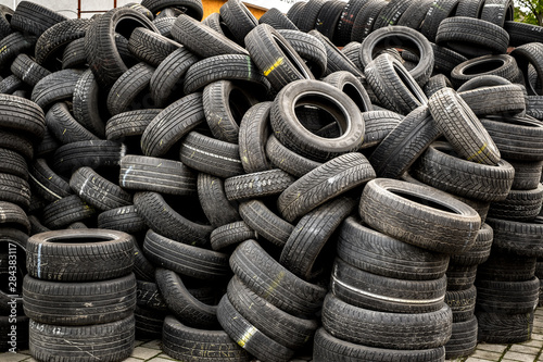 Used tire stacks in Workshop vulcanization yard photo