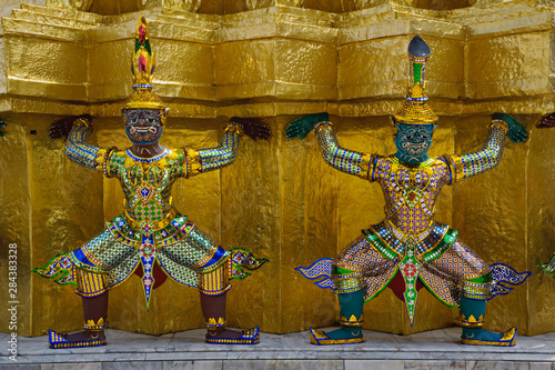 Khon figures guarding stupa, Wat Phra Kaeo, Bangkok, Thailand.