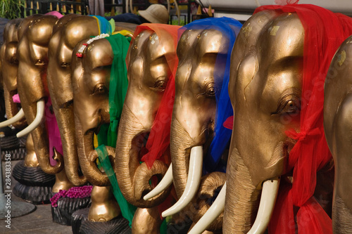 Photography Golden elephants decorated with colorful scarves, Erawan Shrine, Bangkok, Thaila