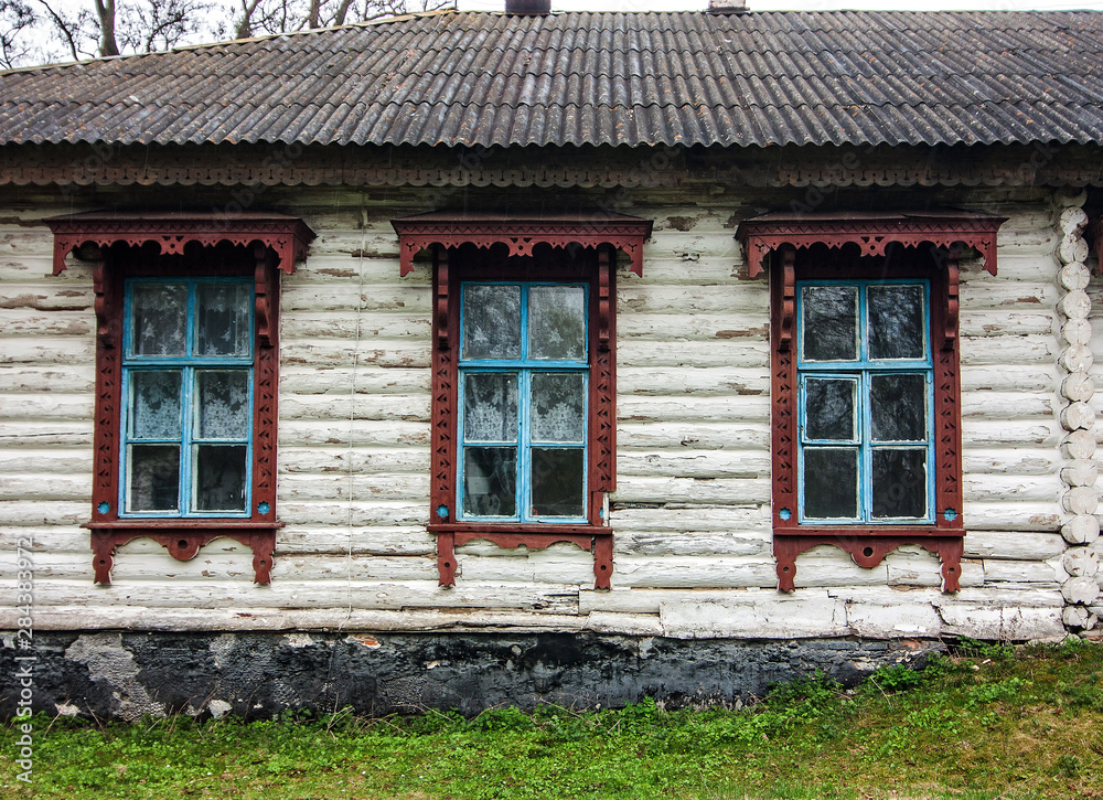 Wooden old privat house with windows in Ukraine