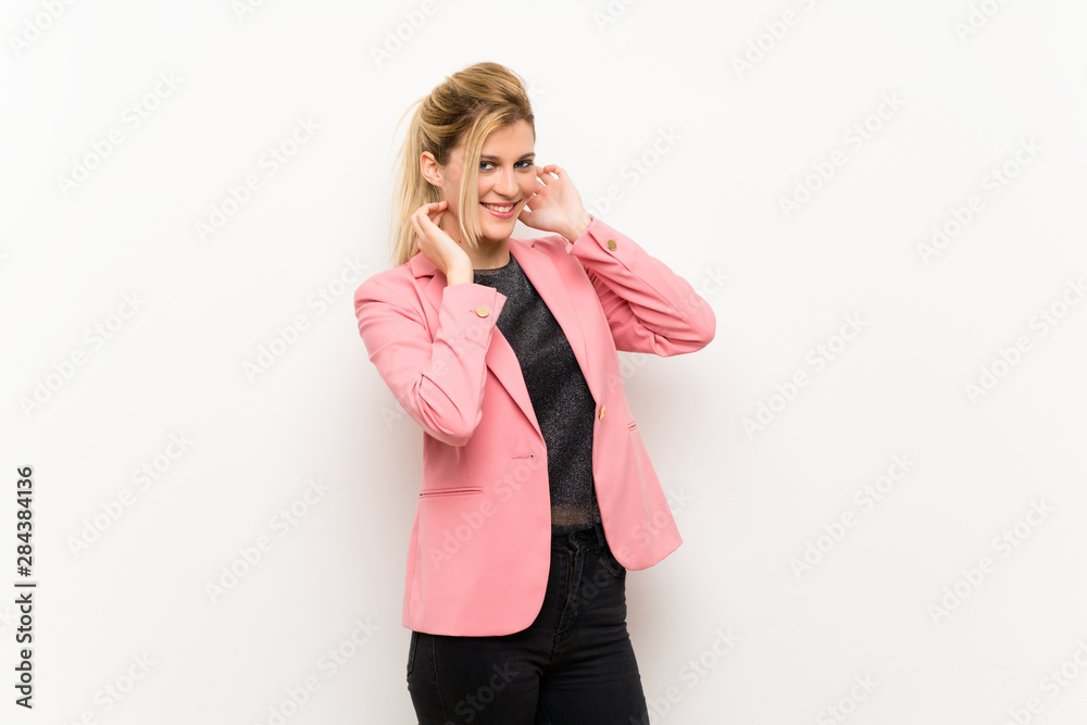 Young blonde woman with pink suit smiling Young blonde woman with pink suit smiling