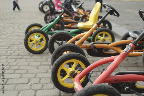 child tricycle bikes on the pavement  © taraskobryn
