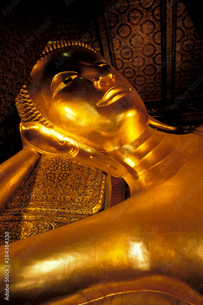 Asia, Thailand, Bangkok. Wat Po, golden reclining Buddha.
