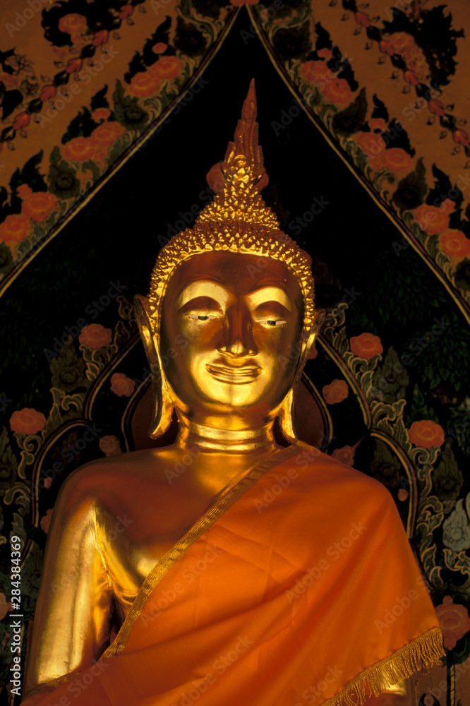 Asia, Thailand, Bangkok. Wat Arun (Temple of Dawn), golden Buddha in meditation.