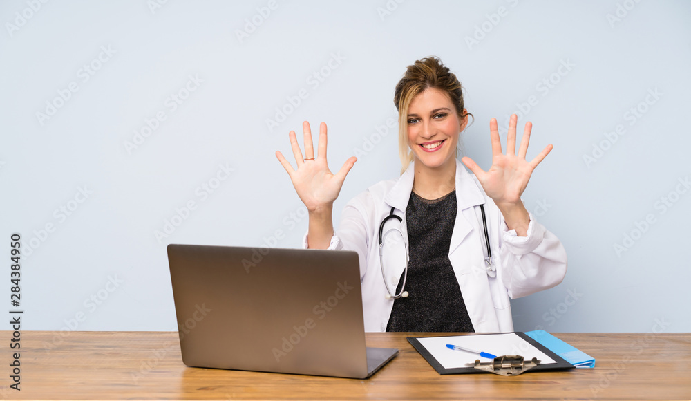 Blonde doctor woman counting ten with fingers Blonde doctor woman counting ten with fingers