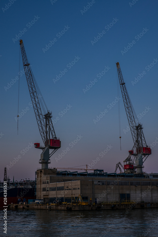 Old cranes, docks, warehouses and industrial buildings at the Helsinki port - 2