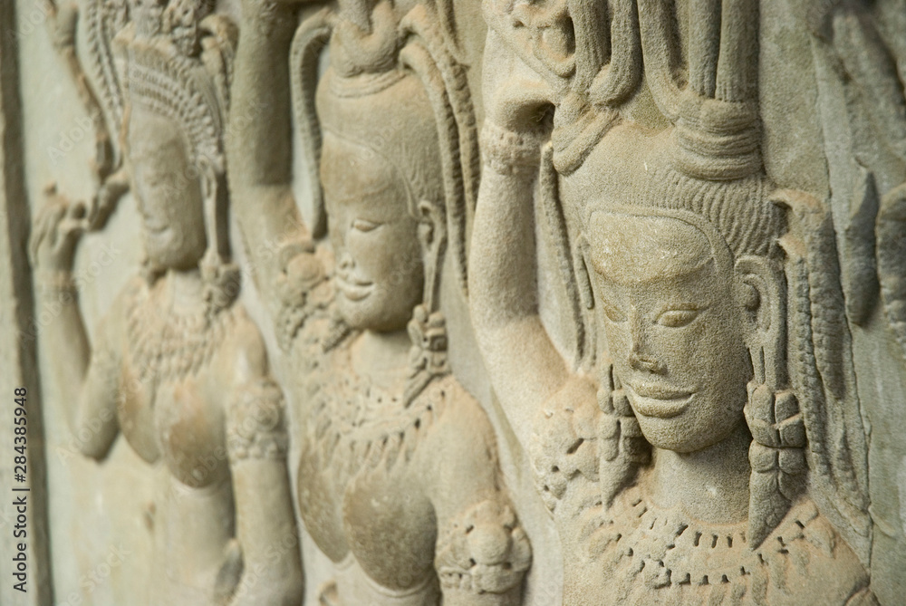 Cambodia. Siem Reap. Angkor Wat. Apsaras carved into the walls.