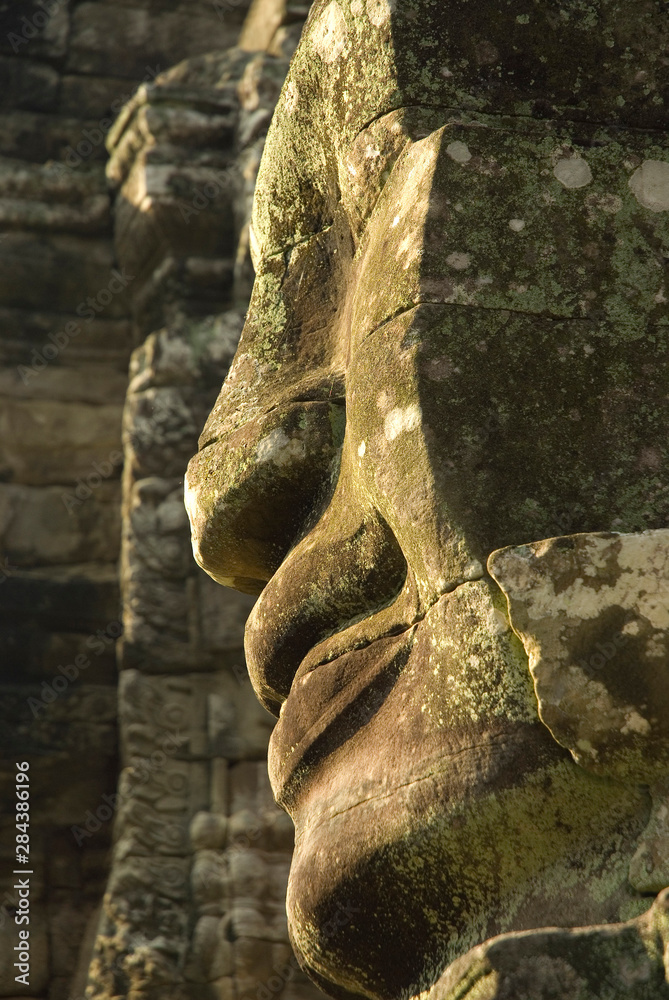 Cambodia. Siem Reap. Angkor Thom. Carved face on the upper level of Bayon Temple.