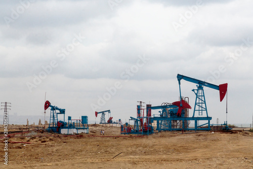 Azerbaijan, Baku. Oil pumpjacks in the badlands outside of Baku.