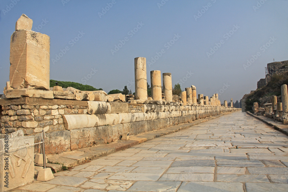 The Marble Road near the Celsius Library heading toward the Great Theater in the ancient city ruins of Ephesus, Turkey near Selcuk with copy space.