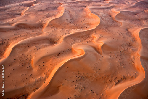 Aerial view of the sand dunes of the Arabian Desert next to Dubai, United Arab Emirates