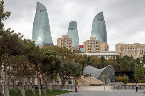 Azerbaijan, Baku. A park in Baku with the Flame Towers in the distance. photo