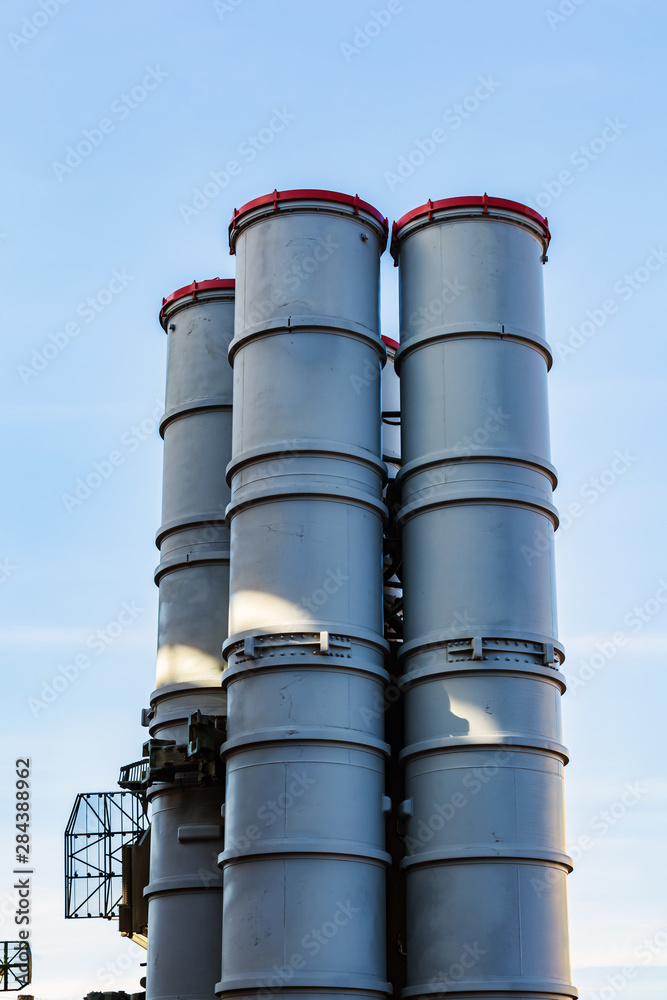 Air defense missiles against the blue sky. Air defense launcher, long-range missile system. SAM on combat duty in a state ready for launch. Air defense missiles against the blue sky. Air defense launcher, long-range missile system. SAM on combat duty in a state ready for launch.