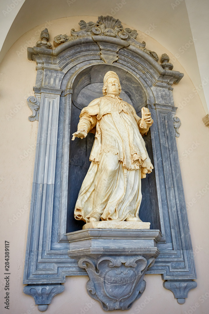 statue of a Catholic priest in a monastery
