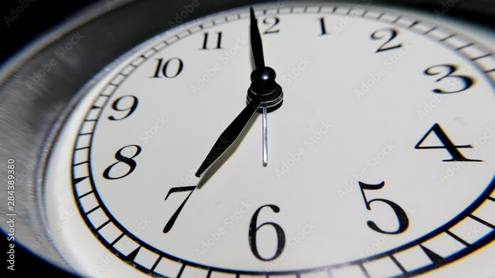 The Clock With Black Arrows Shows The Time Seven Hours Timelapse. The Clock With Black Arrows Shows The Time Seven Hours Timelapse.