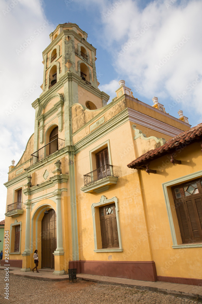 Cuba, Trinidad, woman entering Church and Monastery of Saint Francis (Iglesia y Convento de San Francisco). Trinidad and the Valley de los Ingenios is a UNESCO World Heritage Site