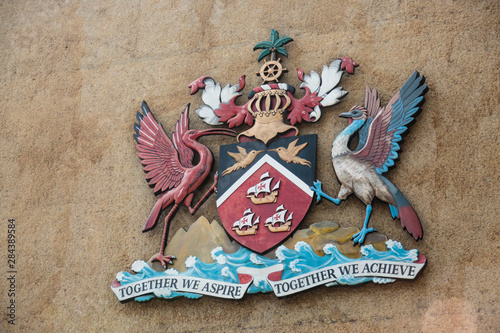 Trinidad, Port-of-Spain. Close-up of Trindad's coat of arms on building. photo