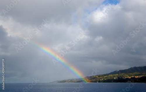 MARTINIQUE. French Antilles. West Indies. Rainbow over harbor at St. Pierre.