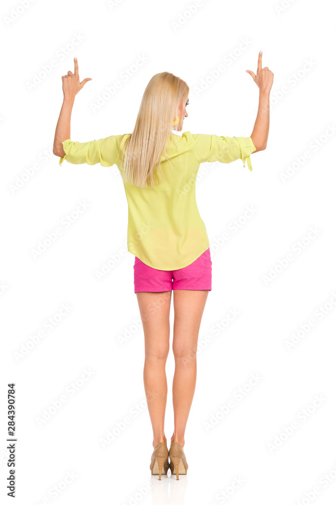 young woman with arms raised young woman with arms raised