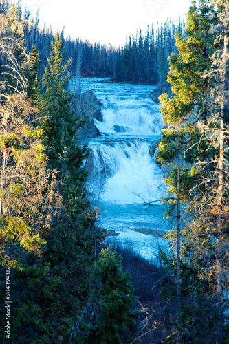 Smith Falls, Fort Halkett Park is located at the confluence of Smith River and Liard River, near Kilometer 820 of the Alaska Highway and about 30 km west of Liard Hot Springs Park.
